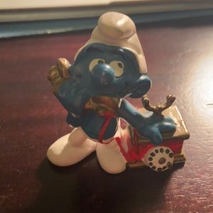 Vintage smurf on phone figurine